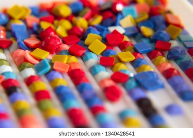 the background is multi-colored square elements of diamond mosaic. macrophotography