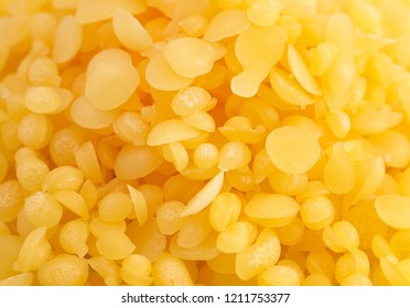 A Background Of Natural Yellow Beeswax Pearls