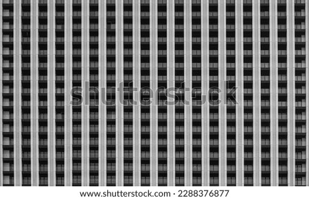 background of new high rise apartment building wall with many balcony and a lot windows. facade, exterior backdrop. facade of a multi-storey residential building. 