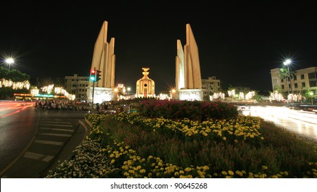Background: night scene of democracy monument with flower plant in Bangkok, Thailand - Shutterstock ID 90645268