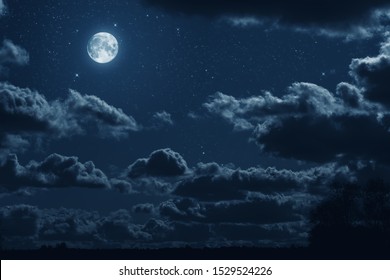 background night sky with  moon, stars and clouds - Powered by Shutterstock