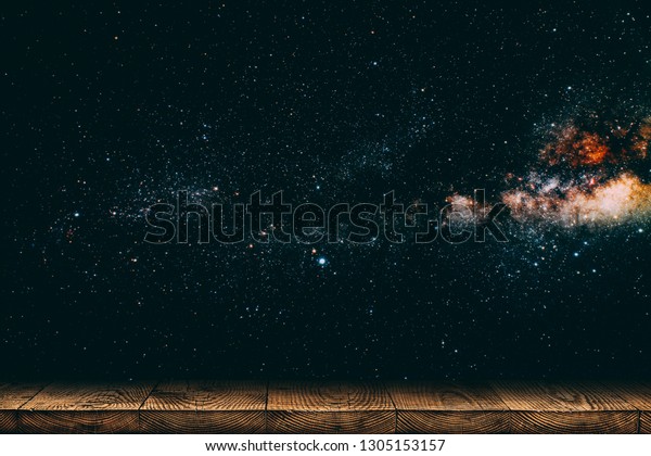 background night sky with stars,\
moon and clouds. wood floor. Elements of this image furnished by\
NASA