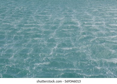 The background of ocean wave caused by the wind of the helicopter.