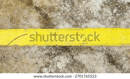 Background of old horizontal yellow lines on a concrete cement floor.