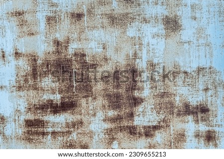 The background of an old iron sheet painted blue with rust spots