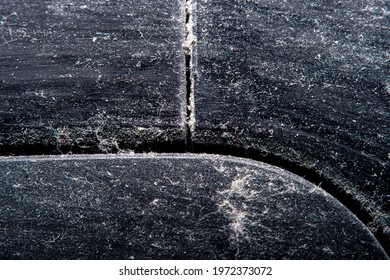 A background with an old plastic surface in soft focus at high magnification. Equipment surface covered with a thick layer of dust