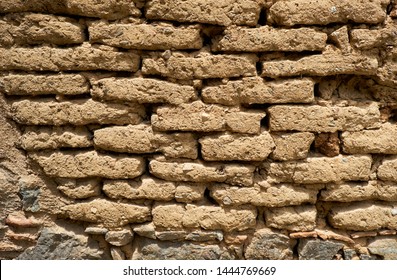 Background Of Old Wall Made Of Adobe Or Mudbrick Masonry.