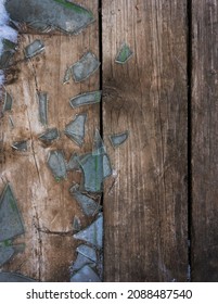 Background From Old Wooden Boards With Glass Shards. Broken Glass Texture On Wooden Floor In Winter.