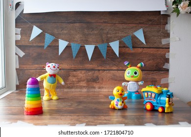 Background For One Year Old Baby Photo Shoot. Paper Garland On Wooden Backdrop With Toys. For Little Boys And Girls. 