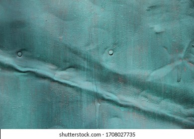 Background Painted Iron Wall Light Blue With A Dent And Cracked Paint.dent In Iron