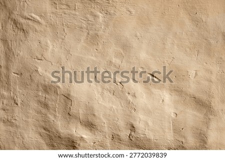 background pattern of ochre brown  painted plaster wall in irregular structure