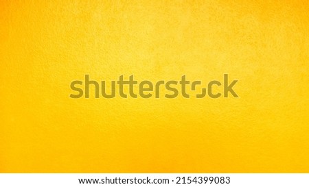 Closeup​ yellow​ wall​ texture​ for​ background. Grunge​ wall​ texture​ for​ vintage​ backgroun​d. Cement​ wall​ pattern for​ background. Concrete​ wall​ texture​ for​ background. Yellow​ texture.