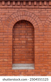 Background of patterned brick wall between arches.