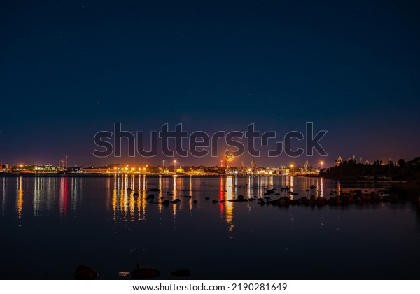 background photo of City port with city lights and\
full shining moon
