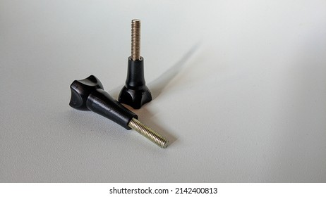 Background Photo Of Two Webcam Tripod Bolts.