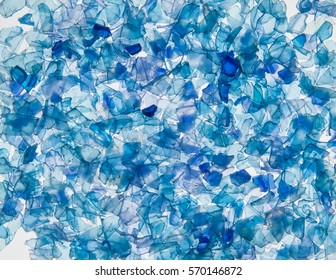 background of the pieces of plastic bottles blue colored. sliced pieces PET of bottles