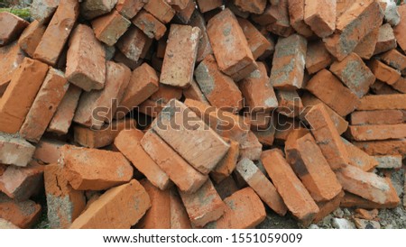 Background of the pile of red bricks