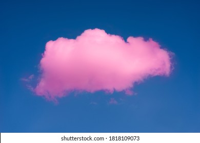 Background pink cloud in front of a blue sky