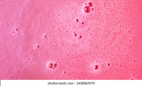 Background of pink dissolve bath bomb in water