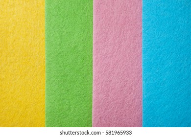 Background of pink, yellow, blue, green felt closeup