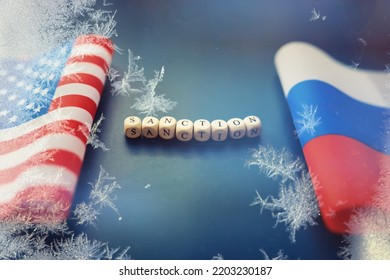 The Background Is Political. American And Russian Flag On Background. US Sanctions Against Russia. Exacerbation Of Dipomotic Relationships.