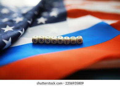 The Background Is Political. American And Russian Flag On Background. US Sanctions Against Russia. Exacerbation Of Dipomotic Relationships.