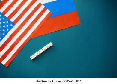 The Background Is Political. American And Russian Flag On Background. US Sanctions Against Russia. Exacerbation Of Dipomotic Relationships.