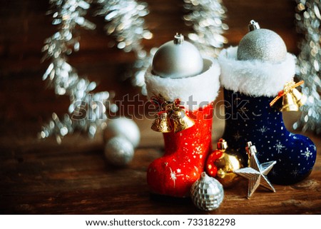 Background, postcard for the new year: a lot of boots Santa with Christmas toys