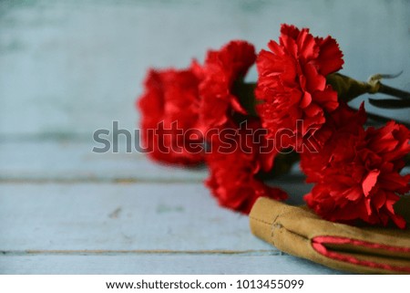 background for postcards by may 9, victory day: cap, letters, carnations and St. George ribbon