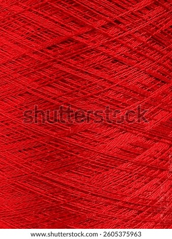 background of red yarn in a bobbin ,close-up