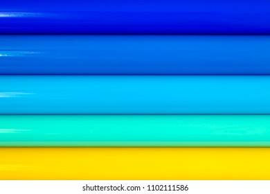 Background of rolls of colored vinyl film