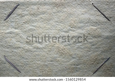 background of rough carboard with plant fibers and threads from plants as a photo frame