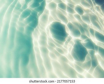 Closeup​ blur​ abstract​ of​ surface​ blue​ water​ for​ background. Reflection​ on​ surface​ blue​ water​ in​ the​ sea. Reflection​ of​ sunlight​ with​ surface​ blue​ water​ in​ the​ swimming​ pool. - Shutterstock ID 2177057153