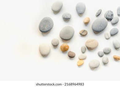 Background with sea stones. Sea stones on a white background. Multi-colored sea stones. - Powered by Shutterstock