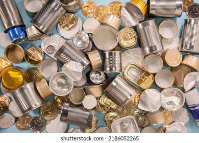 background from separate collected metal garbage. Iron stuff for recycle on blue. Eco friendly concept. Recyclable metal waste background: tin cans, foil, steel covers. Zero waste. Save the planet - Shutterstock ID 2186052265