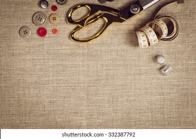 Background with sewing and knitting tools and accesories. Set for needlework placed on flax fabric. Image taken from above, top view. A lot of copyspace. - Powered by Shutterstock