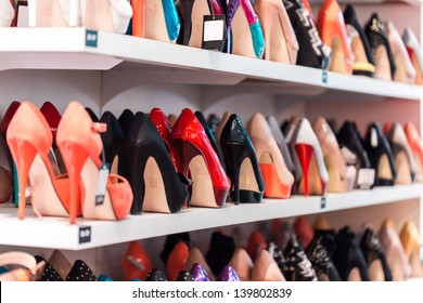 Background With Shoes On Shelves Of Shop