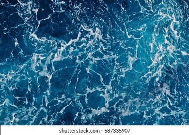 Background shot of aqua sea water surface - Shutterstock ID 587335907