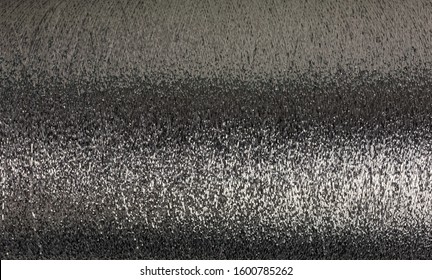 Background Of Silver Lurex Wool On A Cone