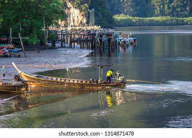 The background of a small fishing boat that is about to dock and there is a blur of water flowing through, being a coexistence of people and nature.