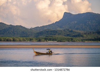 The background of a small fishing boat that is about to dock and there is a blur of water flowing through, being a coexistence of people and nature.