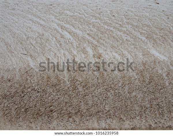 Background splash of dirt
on white metal