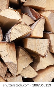 Background From Stack Of Firewood From Birch Tree, For Heating House, Stacked In Backyard, Uncut Wood, Birch. Concept Eco-friendly Home Heating During Cold Season. Soft Selective Focus. Vertical.