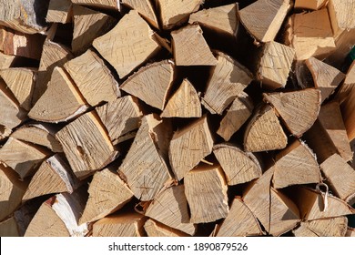 Background From Stack Of Firewood From Birch Tree, For Heating House, Stacked In Backyard, Uncut Wood, Birch. Concept Eco-friendly Home Heating During Cold Season. Overall Plan. Horizontal Format.