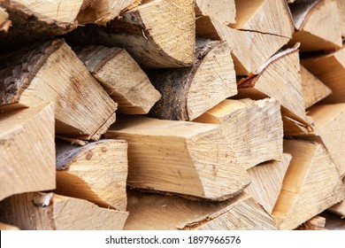 Background From Stack Of Firewood From Birch Tree, For Heating House, Stacked In Backyard, Uncut Wood, Birch. Concept Eco-friendly Home Heating During Cold Season. Soft Selective Focus. Horizontal.