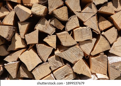 Background From Stack Of Firewood From Birch Tree, For Heating House, Stacked In Backyard, Uncut Wood, Birch. Concept Eco-friendly Home Heating During Cold Season. Overall Plan. Horizontal Format.