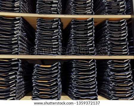 Background of stack jeans at the outlet