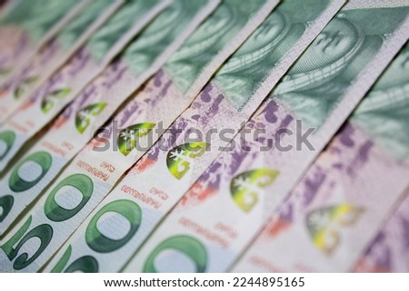 Background from stack of paper green banknotes 50 GEL. Georgian lari. Cash. Printing press. Money to pay for purchases, gift, bribe, loan, debt. Concept of travel, tourism. Tbilisi. Georgia. Banking