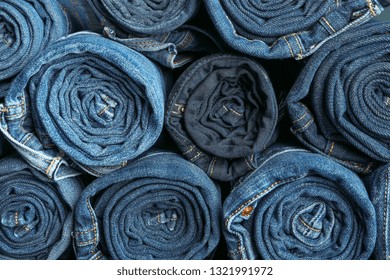 Background of a stack rolled jeans, space for text