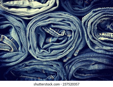 background of a stack rolled jeans (vintage)